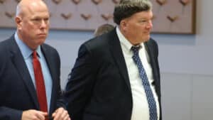 Alleged Gilgo Beach serial killer Rex A. Heuermann, right, appears at Suffolk CountyCourt in Riverhead on Wednesday, accompanied by his attorney, Michael J. Brown. Credit: Newsday/James Carbone